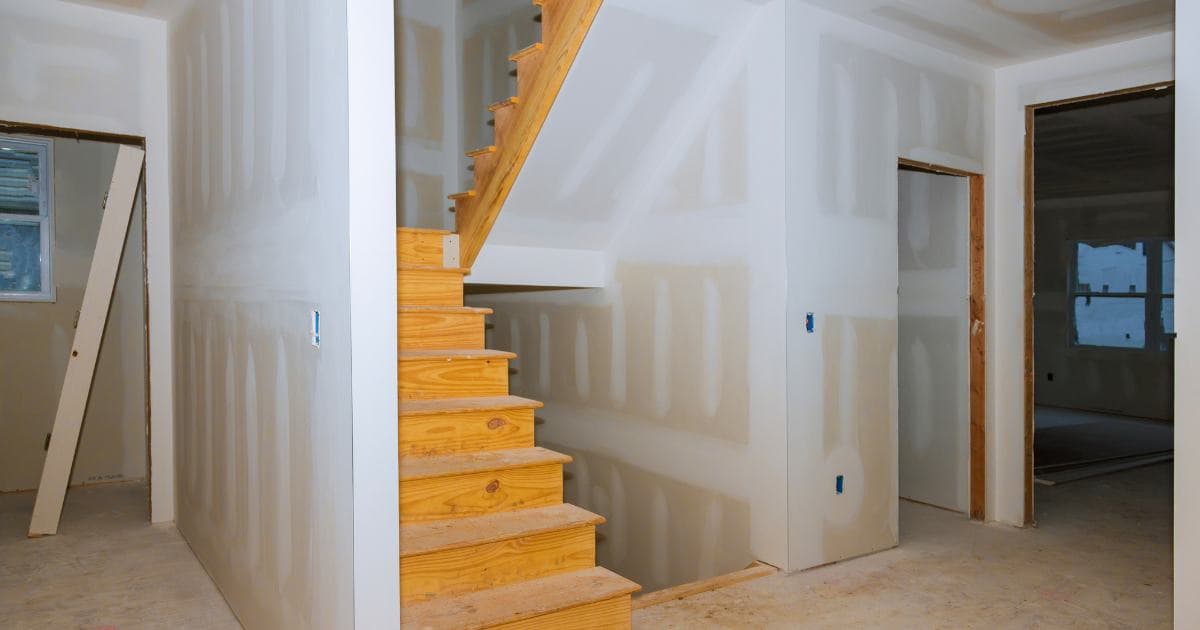 Homeowner reviewing paperwork with a licensed restoration contractor